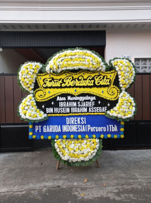 Papan Bunga Duka di Tayando Yamru